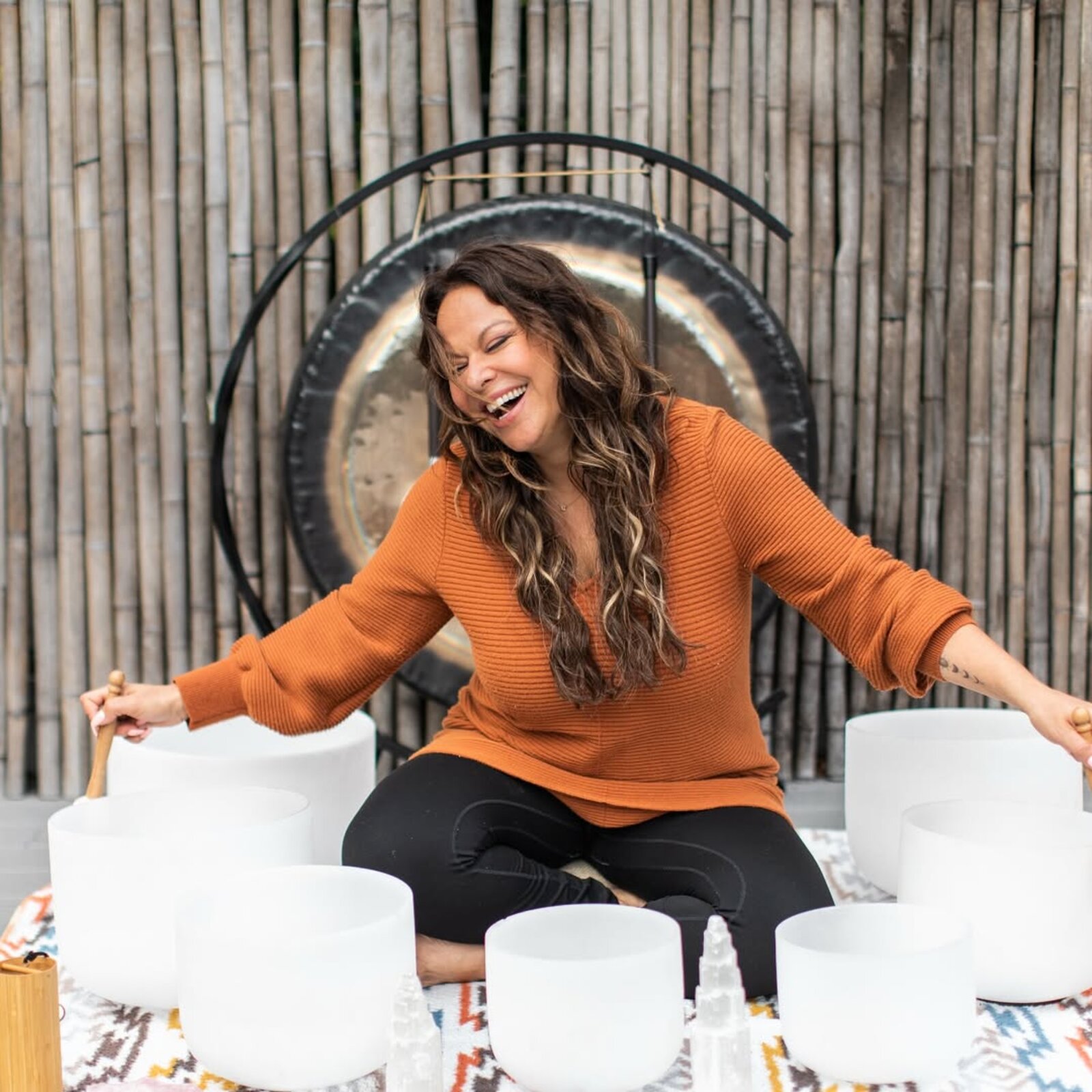 Noura with the Soundbath Haven crystal singing bowl set